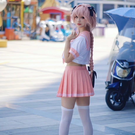 Flattering model wearing femboy astolfo cosplay, front view.