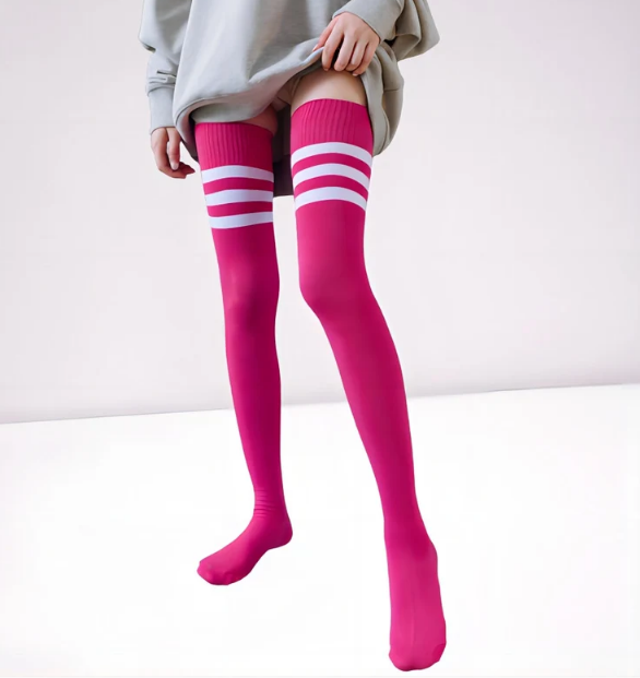Model wearing triple striped thigh highs, front view