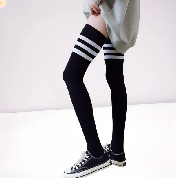 Model wearing triple striped thigh highs, side view