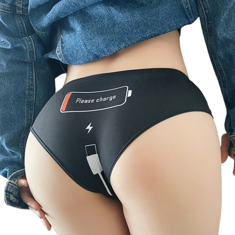 Model showcasing Femzai Please Charge black panties, emphasizing the playful embroidery and comfortable fit.