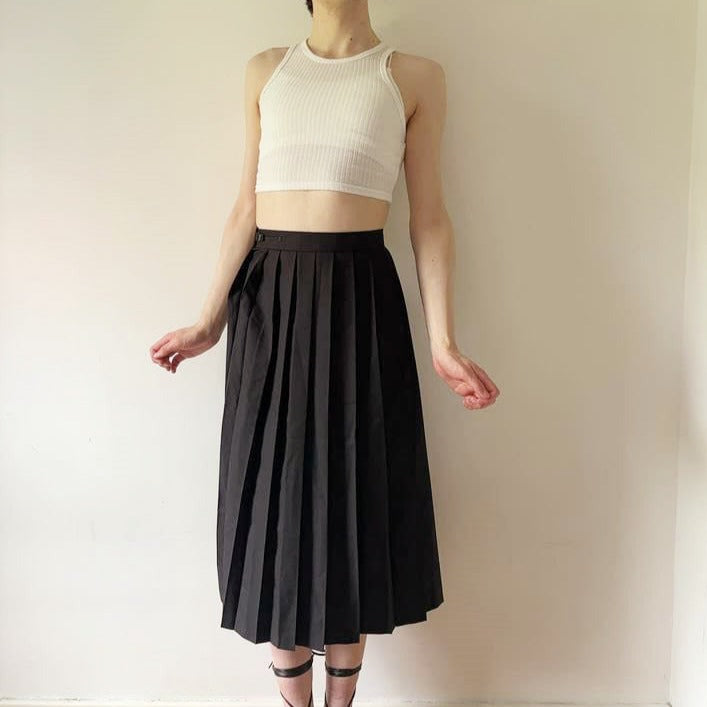 Model wearing long pleated skirt, Femzai model, femboy model