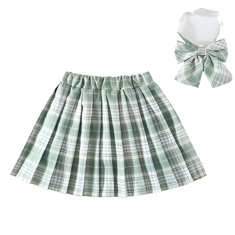 Medium shot of a Femzai Lightly Gridded Skirt in green, paired with a coordinating bow tie, embodying a vibrant addition to femboy clothing collections. The skirt’s crisp pleats and checkered pattern exude a preppy charm.
