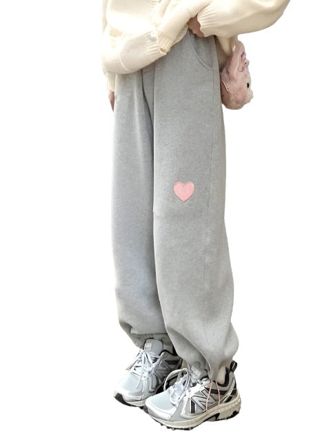 Front view of Femzai Gray Love Heart Sweatpants, featuring a cute love heart graphic and a relaxed fit, in a stylish gray color.