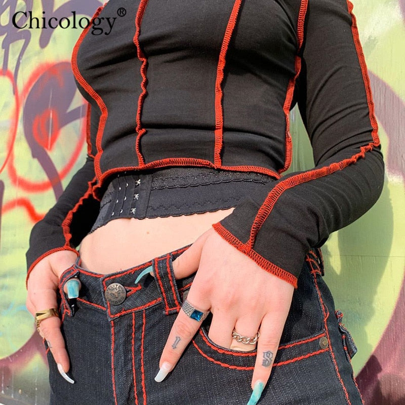 Front view of Femzai Cut Out Crop Top accentuated by a vibrant graffiti wall background, highlighting the unique cut-out design and form-fitting style – femboy attire.