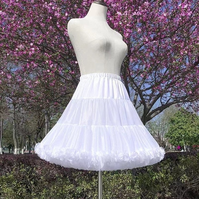 Front view of a mannequin wearing the Femzai Puff Sleeve Goth Dress with just skirt in white, showcasing slick and slender skirt, a stylish piece in femboy attire.