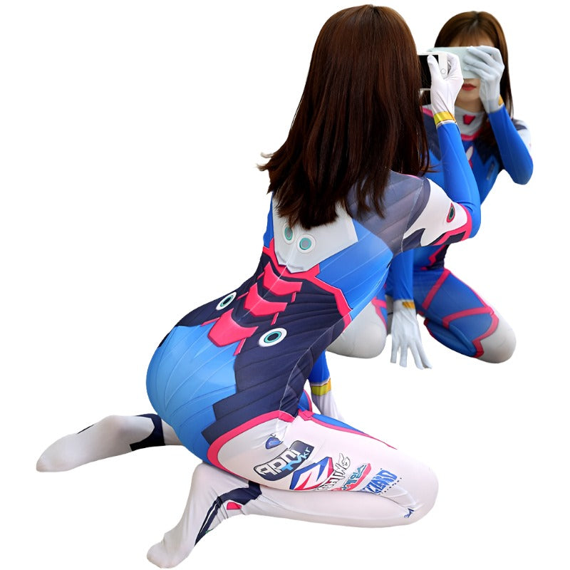 Medium shot rear view of a model wearing a blue and pink Femzai D.Va cosplay suit with white gloves, capturing the intricate designs and branding on the suit against a chic wooden floor background.