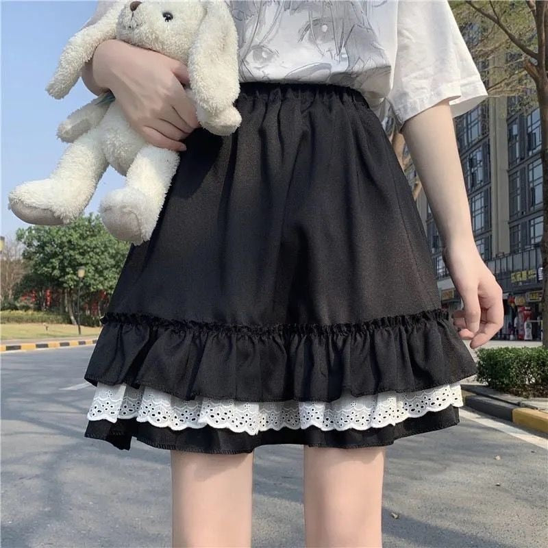 Black Femzai Lace Pleated Ruffle Skirt, waist-down view, showcasing the elegant lace detailing and playful ruffle design, a stylish piece in femboy clothing.