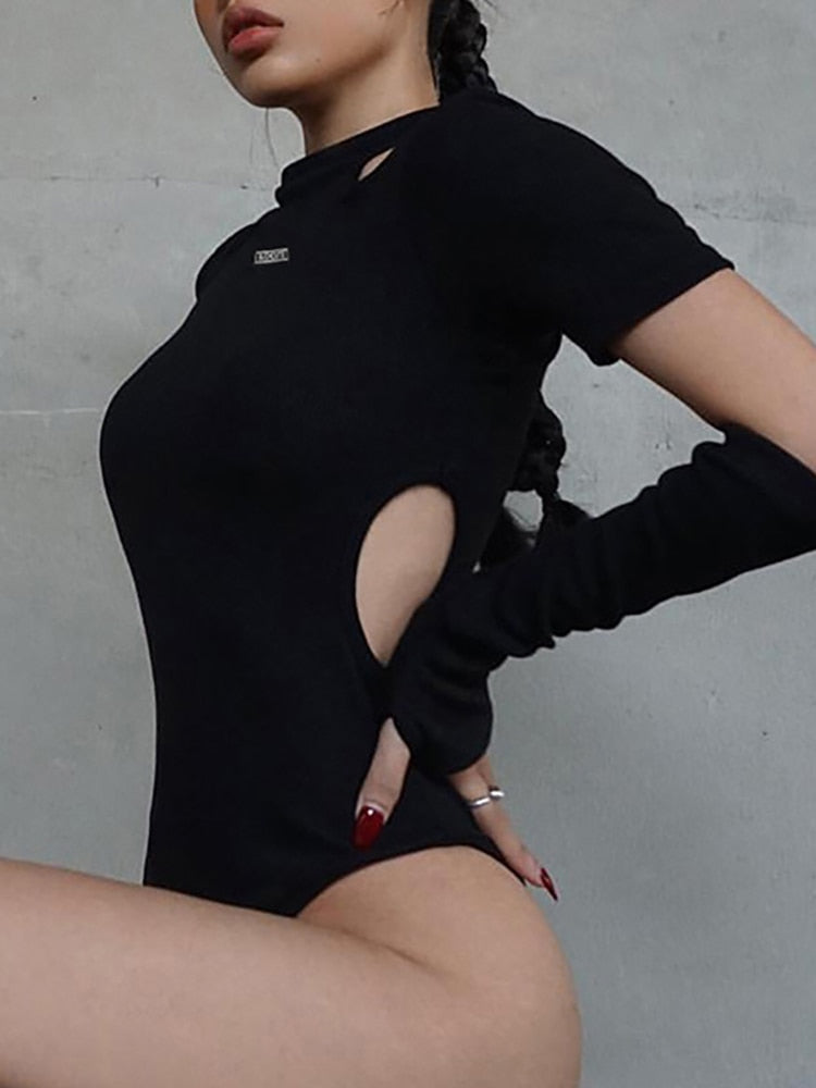Detailed front-side view of the Femzai bodysuit, a key component of femboy attire, as worn by a female model.