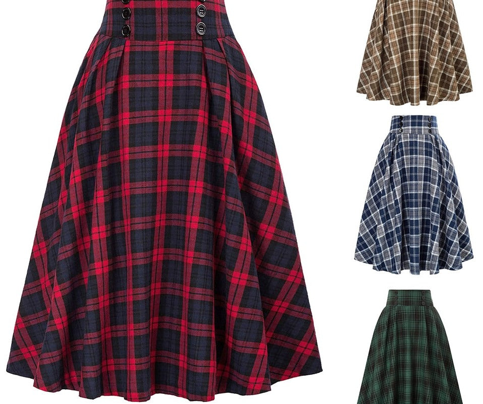A pleated vintage midi skirt in a red and navy plaid pattern, suitable for femboy clothing styles. The skirt is displayed in a full shot that highlights its flare and waistband details.