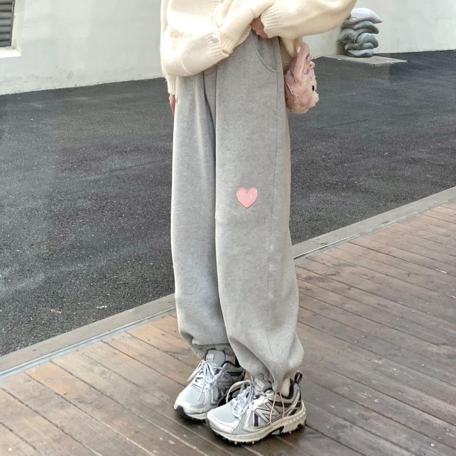 Front view of Femzai Gray Love Heart Sweatpants, featuring a cute love heart graphic and a relaxed fit, in a stylish gray color.