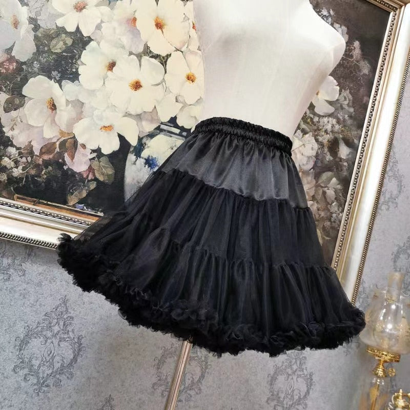 Front view of a mannequin wearing the Femzai Puff Sleeve Goth Dress with just skirt in black, showcasing slick and slender skirt, a stylish piece in femboy attire.