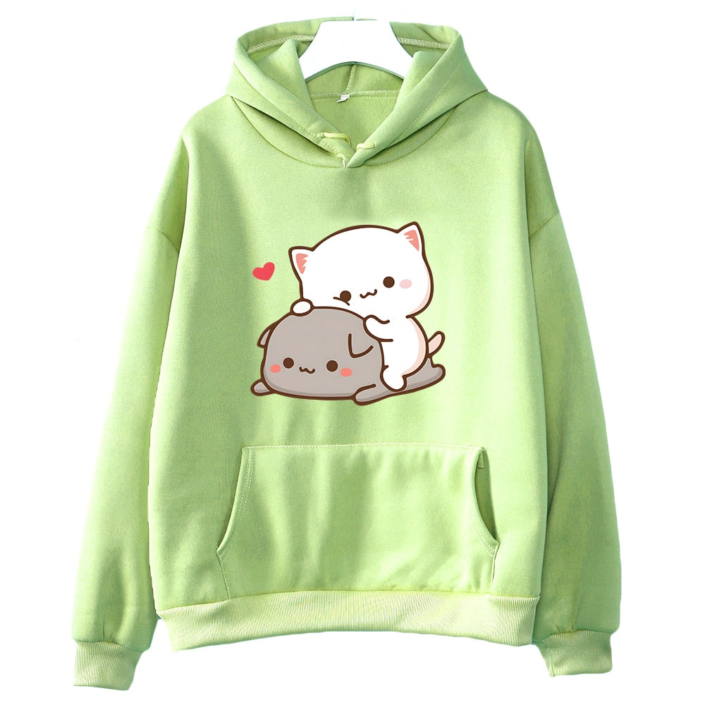 Full view of a vibrant light green Femzai hoodie showcasing the Peach & Goma cat print, aligning with the femboy clothing trend. The hoodie is displayed on a hanger, providing a clear front-facing angle that captures the charming cartoon cats in a loving embrace, with the hoodie's cozy kangaroo pocket and comfortable fit clearly visible.