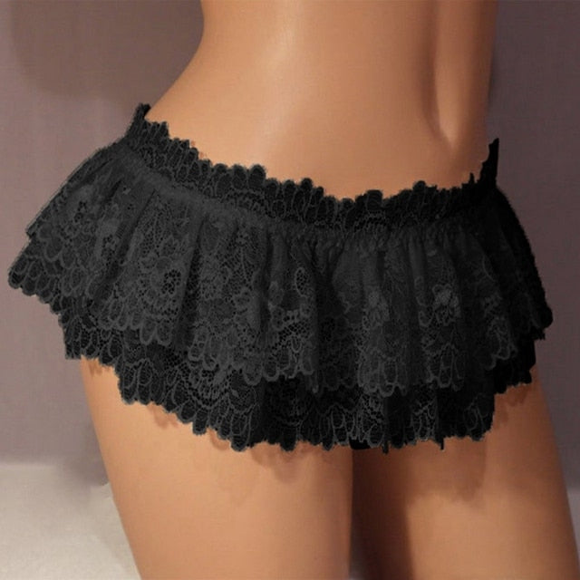 Semi close-up of black Sissy Lace Mini Skirt, front view, showcasing delicate lace detailing, a stylish piece from Femzai's femboy clothing collection.