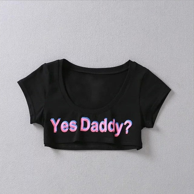 Black 'Yes Daddy' Short-Sleeve Crop Top, front view, showcasing the playful print in femboy attire style.